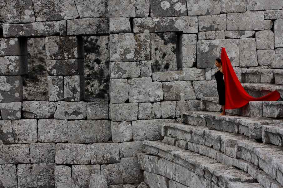 woman standing on concrete stairs